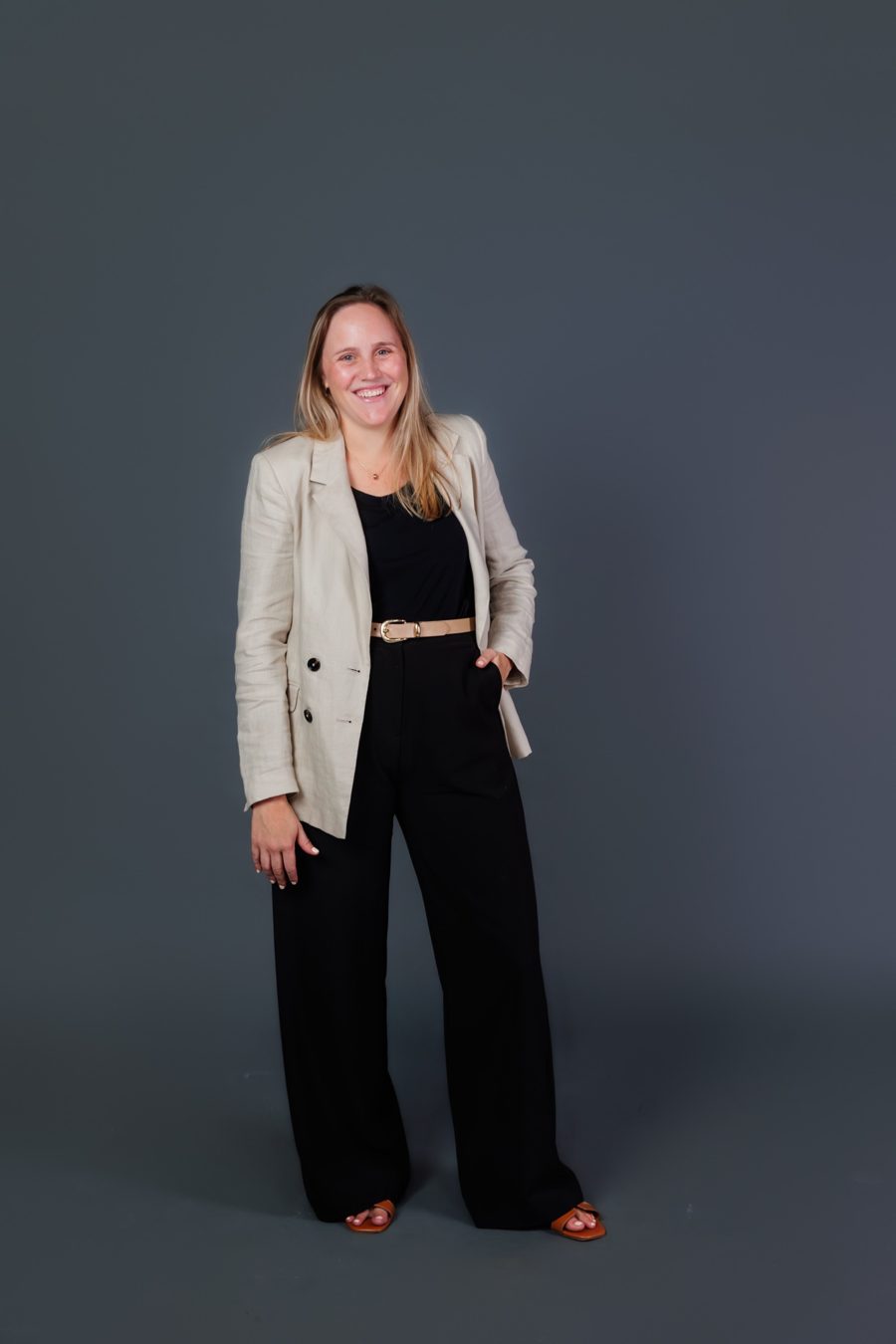Lucia in a blazer, smiling